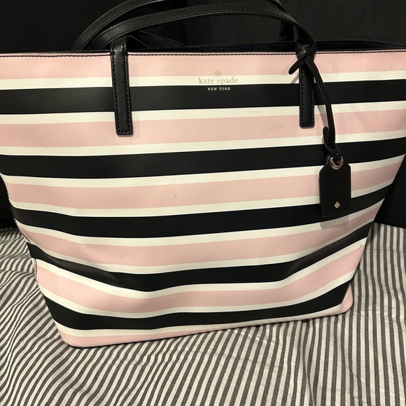 Selling this practically brand new kate spade tote. Very  Kate Spade Janie Celebration Pink and Black Striped Tote